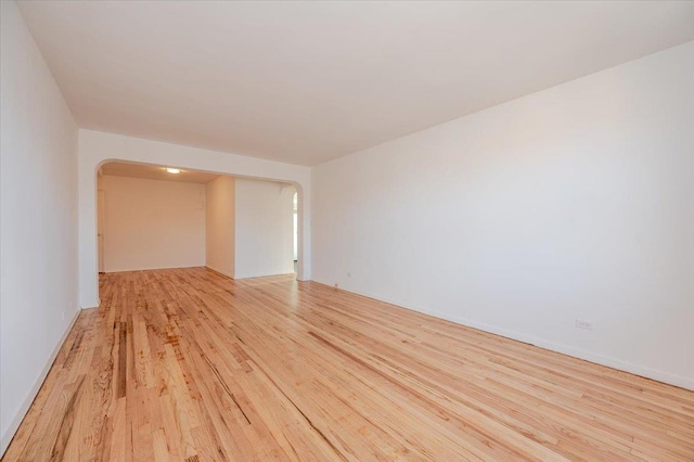 spare room featuring light hardwood / wood-style flooring