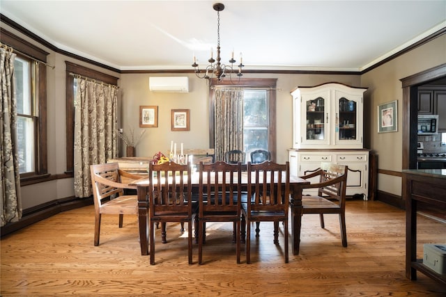 dining space with a notable chandelier, light hardwood / wood-style floors, ornamental molding, and a wall mounted AC