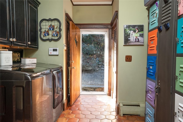 laundry area with cabinets and washing machine and dryer