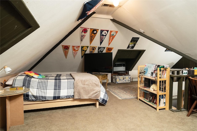 bedroom with lofted ceiling, visible vents, and carpet flooring