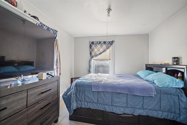 tiled bedroom with cooling unit and multiple windows