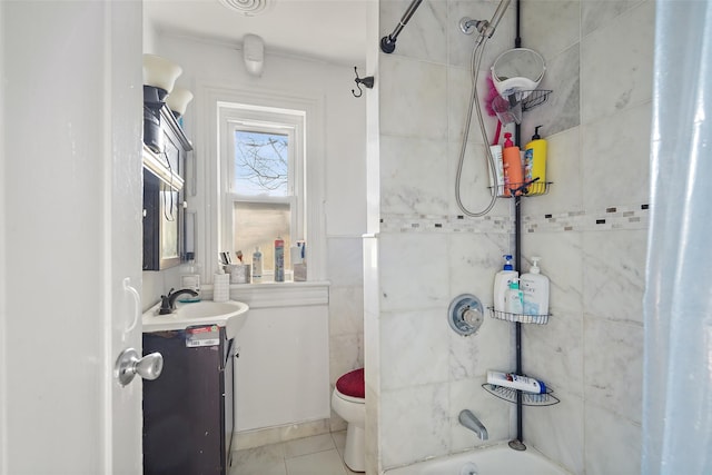 full bathroom with vanity, tiled shower / bath, tile patterned flooring, and toilet