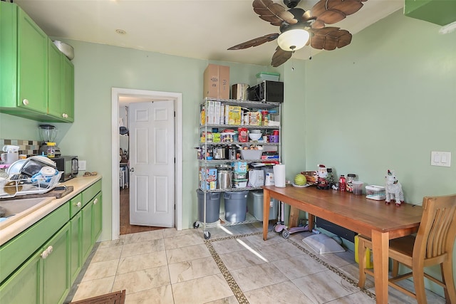 interior space with light tile patterned floors and ceiling fan