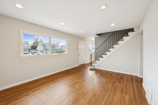 entryway with hardwood / wood-style flooring