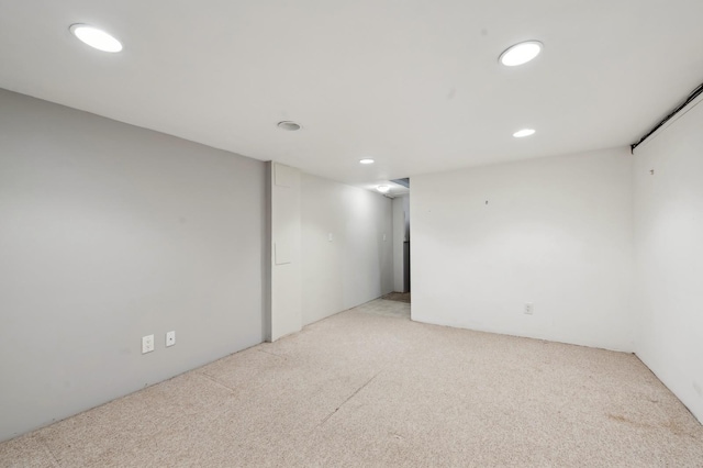 spare room with light colored carpet