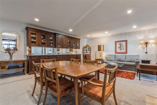 dining space with light colored carpet