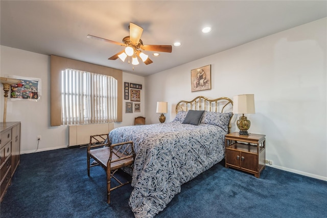 bedroom featuring dark carpet and ceiling fan