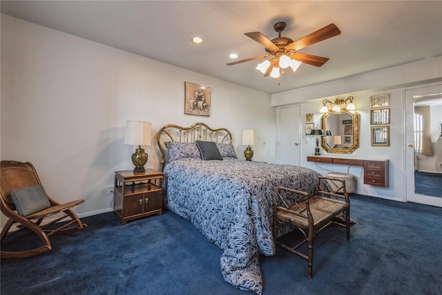 bedroom featuring ceiling fan and dark carpet