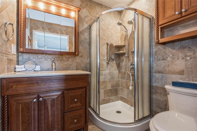 bathroom featuring vanity, tasteful backsplash, walk in shower, and tile walls