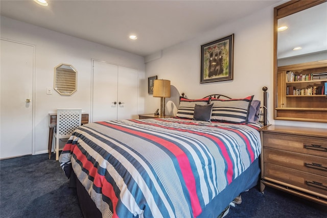 carpeted bedroom featuring a closet