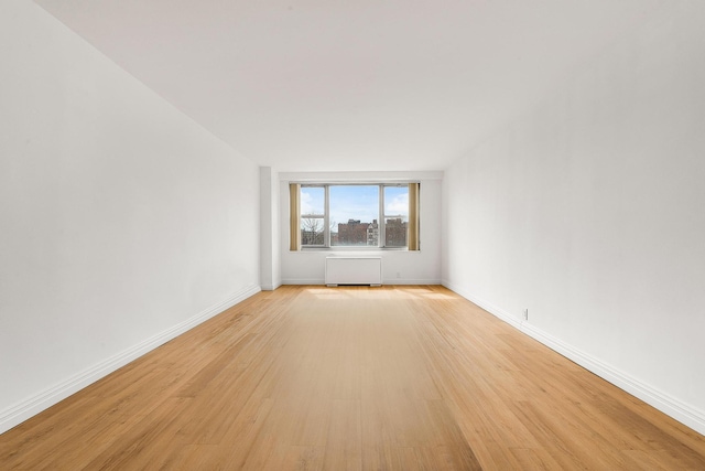 unfurnished room featuring light hardwood / wood-style floors