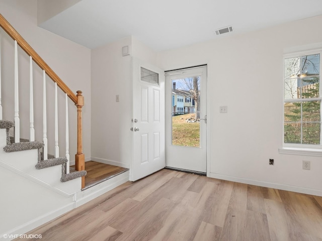 entrance foyer with light hardwood / wood-style flooring