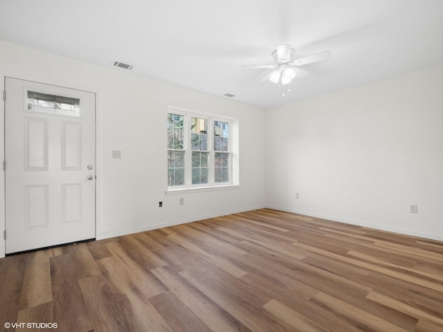 foyer entrance featuring ceiling fan and light wood-type flooring