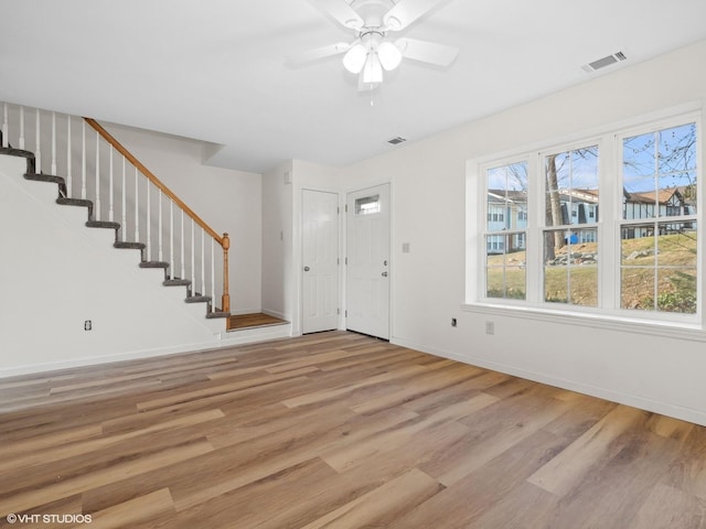 foyer featuring ceiling fan and light hardwood / wood-style flooring