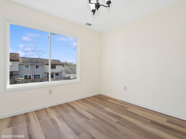 empty room featuring wood-type flooring