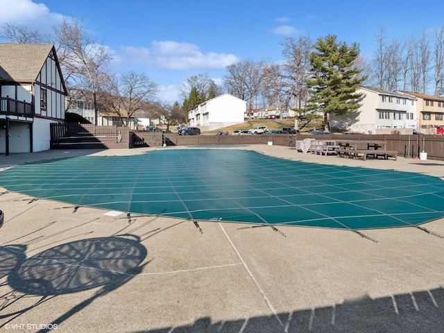 view of swimming pool featuring a patio area