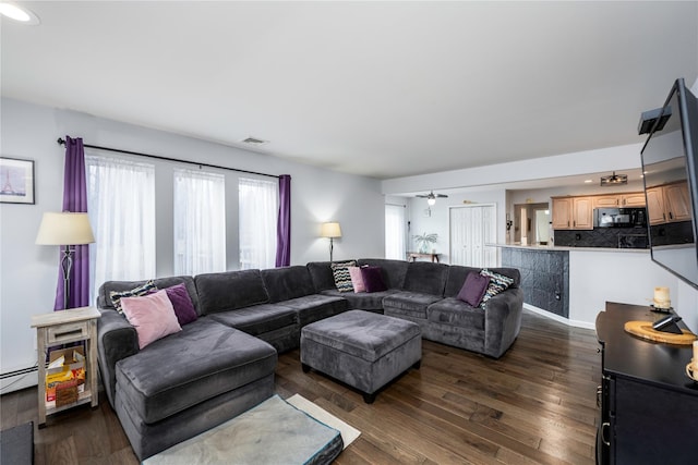 living room featuring dark wood-type flooring