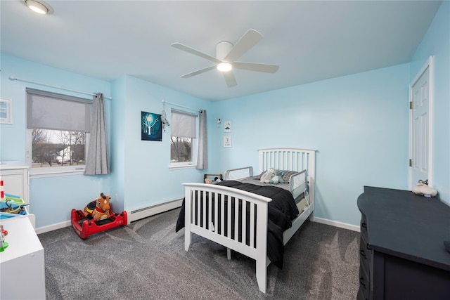 carpeted bedroom with multiple windows, a baseboard radiator, and ceiling fan