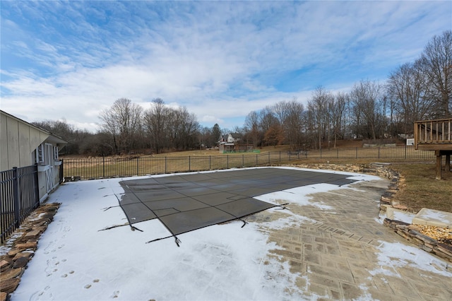 view of swimming pool with a patio