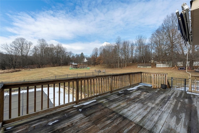 wooden terrace with a lawn