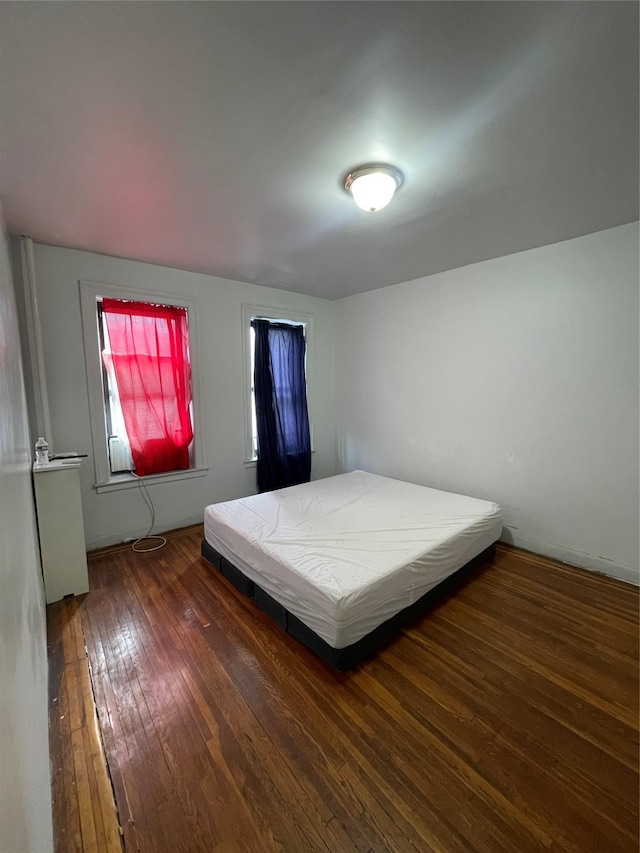 bedroom featuring dark wood-type flooring