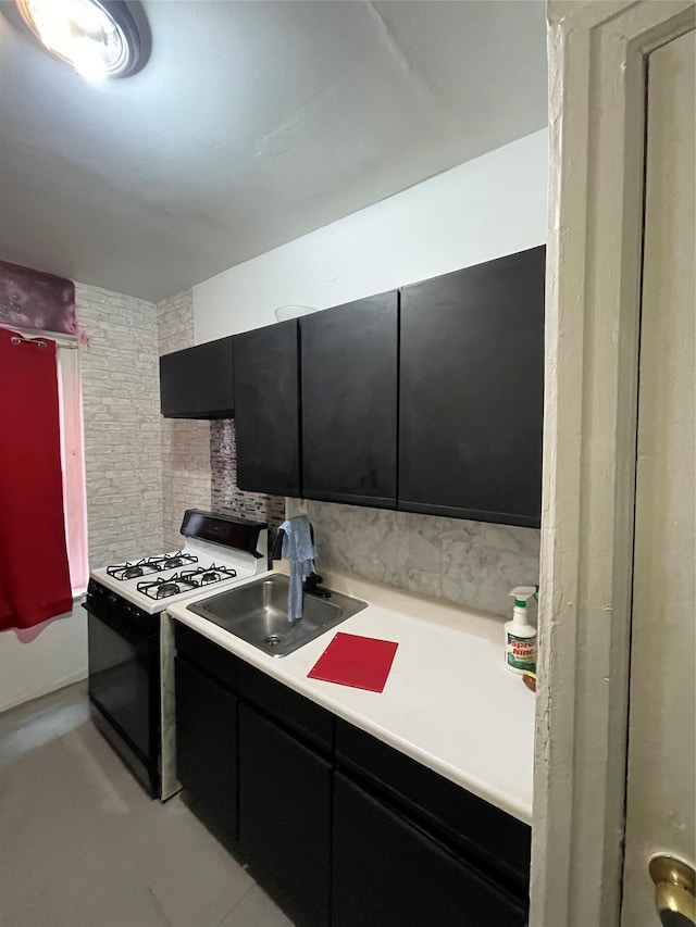 kitchen with sink and black range with gas cooktop