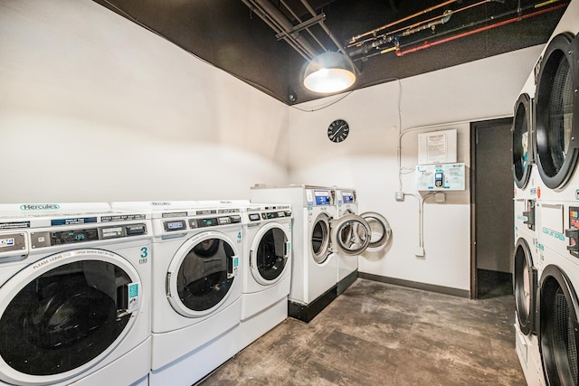 washroom featuring separate washer and dryer and stacked washer / drying machine