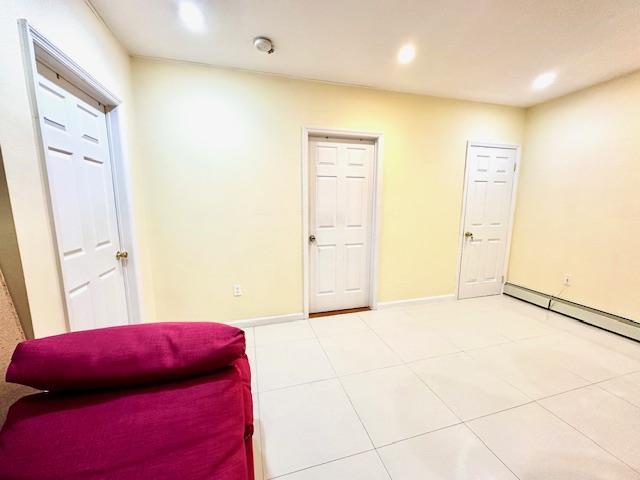 living area with tile patterned floors