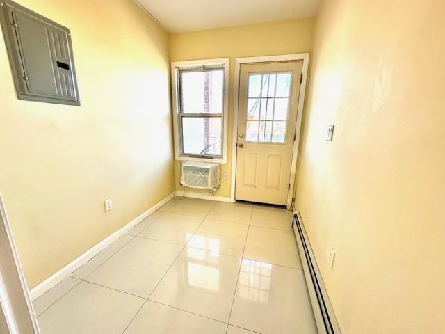 doorway to outside featuring a wall mounted air conditioner, electric panel, a baseboard radiator, and light tile patterned flooring