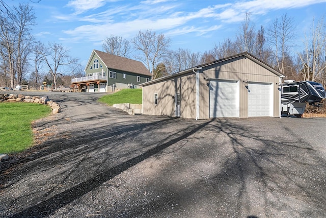 exterior space with an outdoor structure and a garage