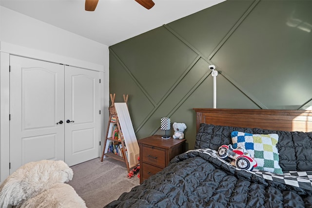 bedroom with carpet flooring, a closet, and ceiling fan