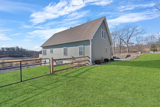 view of property exterior featuring a lawn