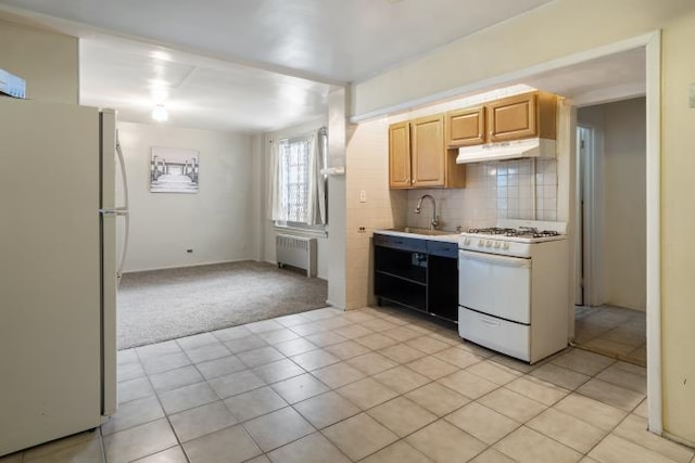 kitchen with light carpet, decorative backsplash, white appliances, light brown cabinets, and radiator heating unit