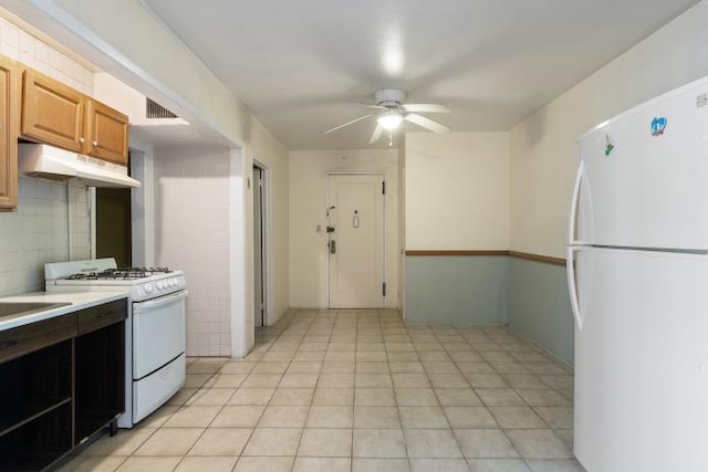 kitchen featuring tasteful backsplash, ceiling fan, light tile patterned floors, and white appliances