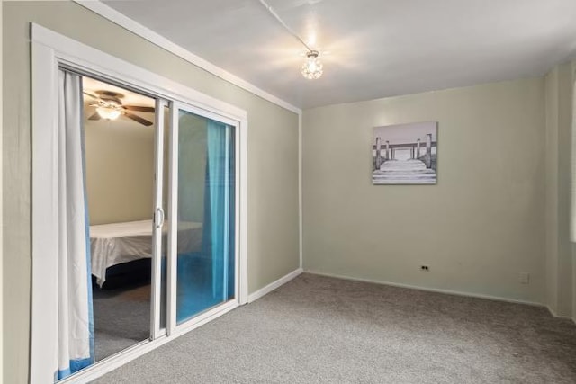 carpeted empty room with ceiling fan