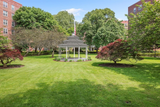 view of property's community with a gazebo and a lawn