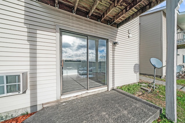 entrance to property with a patio area