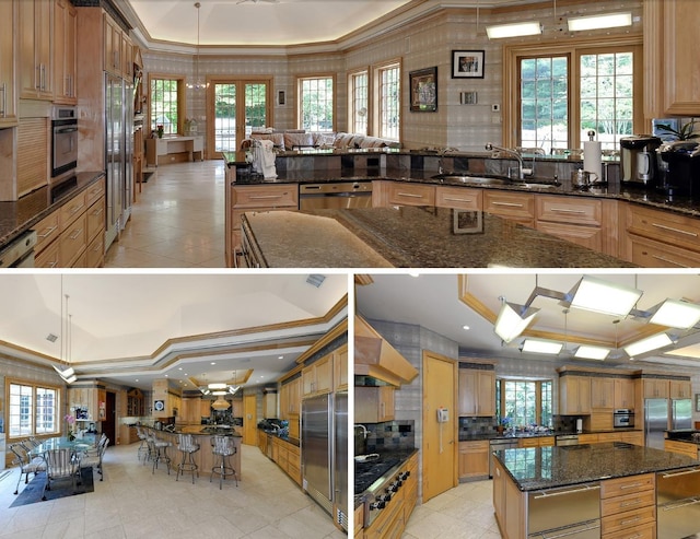 kitchen with sink, crown molding, decorative light fixtures, a kitchen island, and appliances with stainless steel finishes