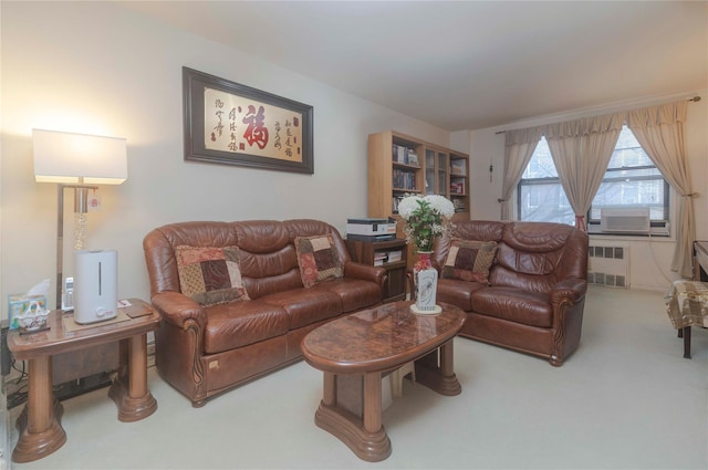 living room with cooling unit, radiator, and carpet floors