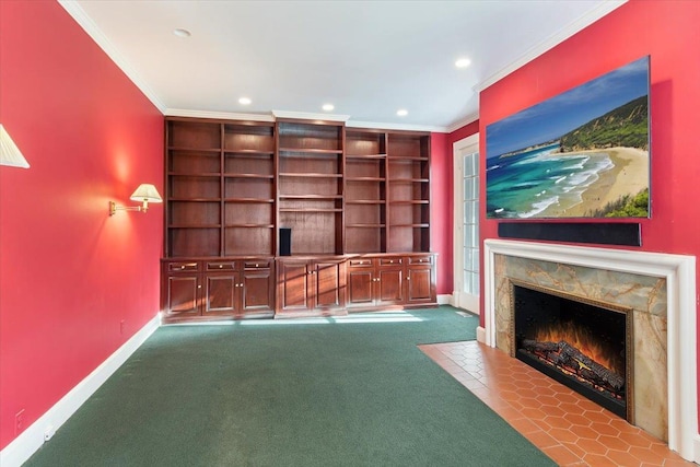 unfurnished living room featuring built in shelves, light carpet, and ornamental molding