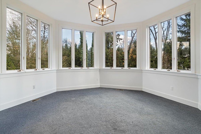 unfurnished sunroom featuring a notable chandelier