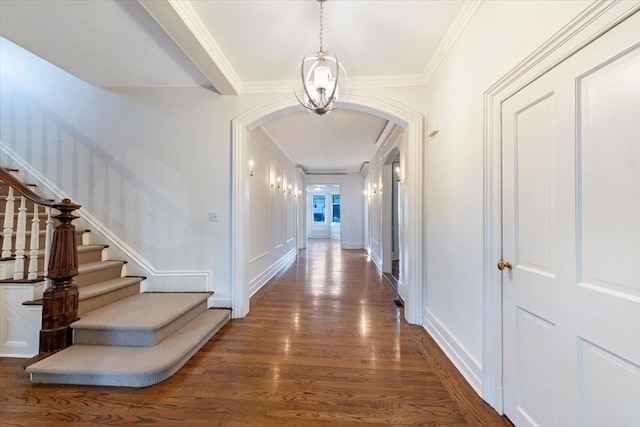 hall featuring crown molding and dark wood-type flooring