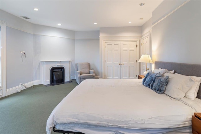 carpeted bedroom with a closet