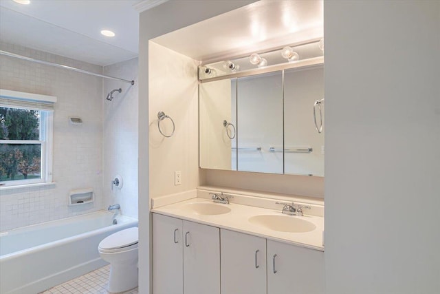 full bathroom featuring tile patterned floors, vanity, toilet, and tiled shower / bath