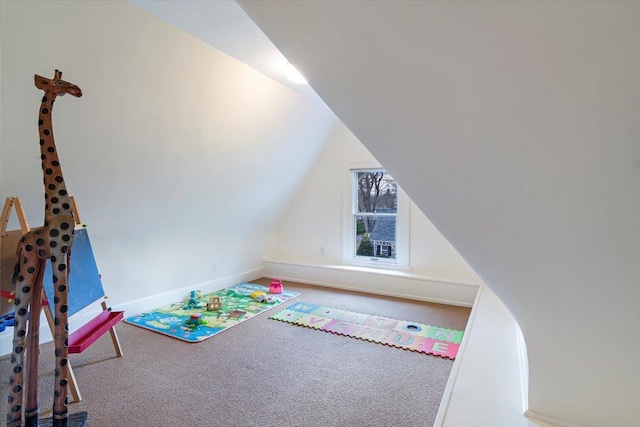 game room with carpet flooring and vaulted ceiling