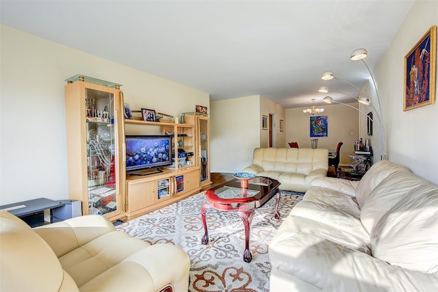 living room with a chandelier and wood-type flooring