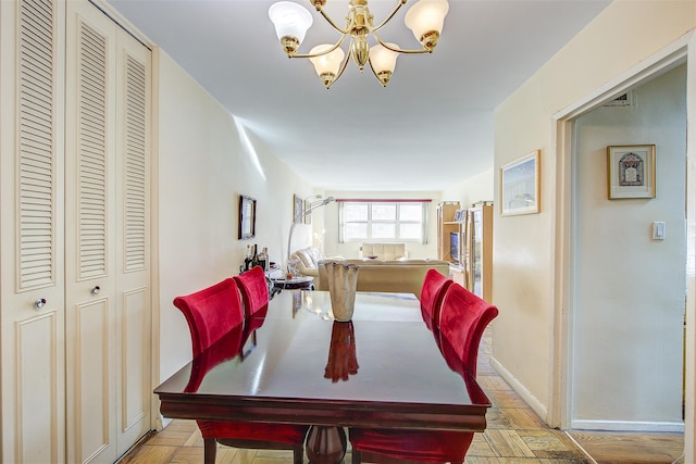 dining area with a notable chandelier