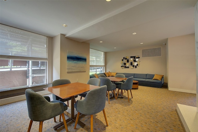 dining room featuring light carpet