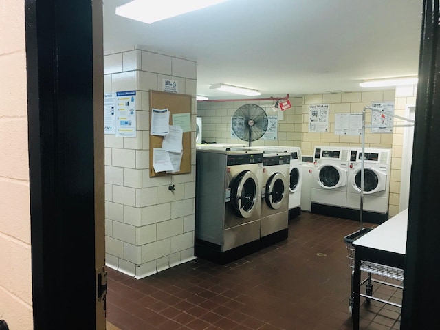 washroom with washing machine and clothes dryer