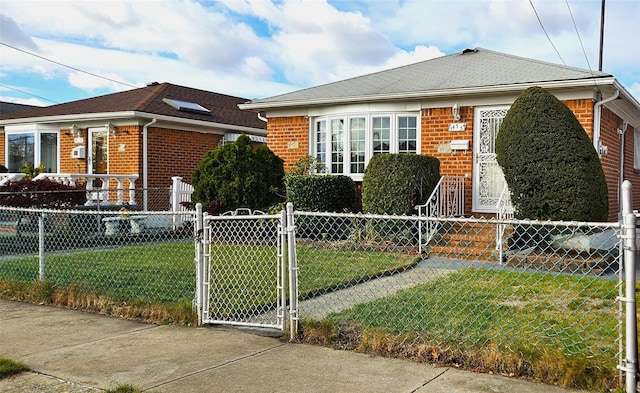 bungalow-style house with a front lawn